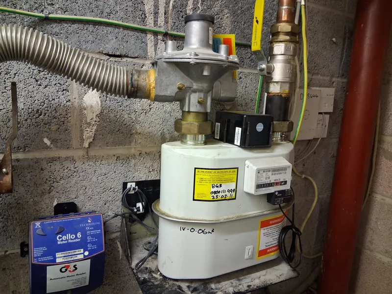Gas meter and emergency control valve with an escape of gas safety notice